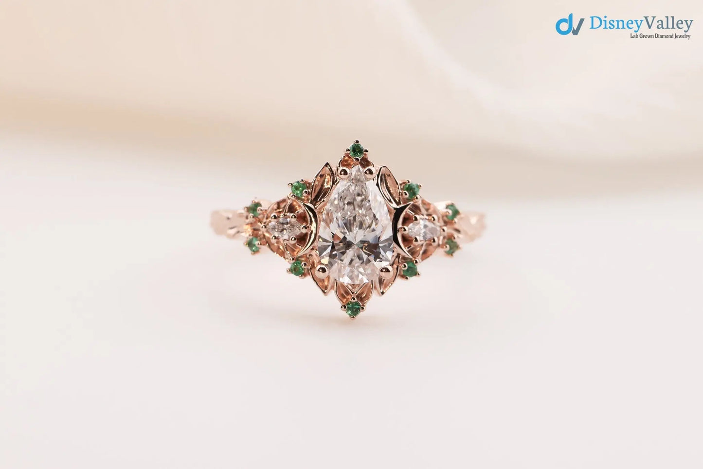 2 caret pear center lab grown with Briar moon three stone rings DisneyValley