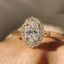 Oval Shaped Engagement Ring In Halo Milgrain Style