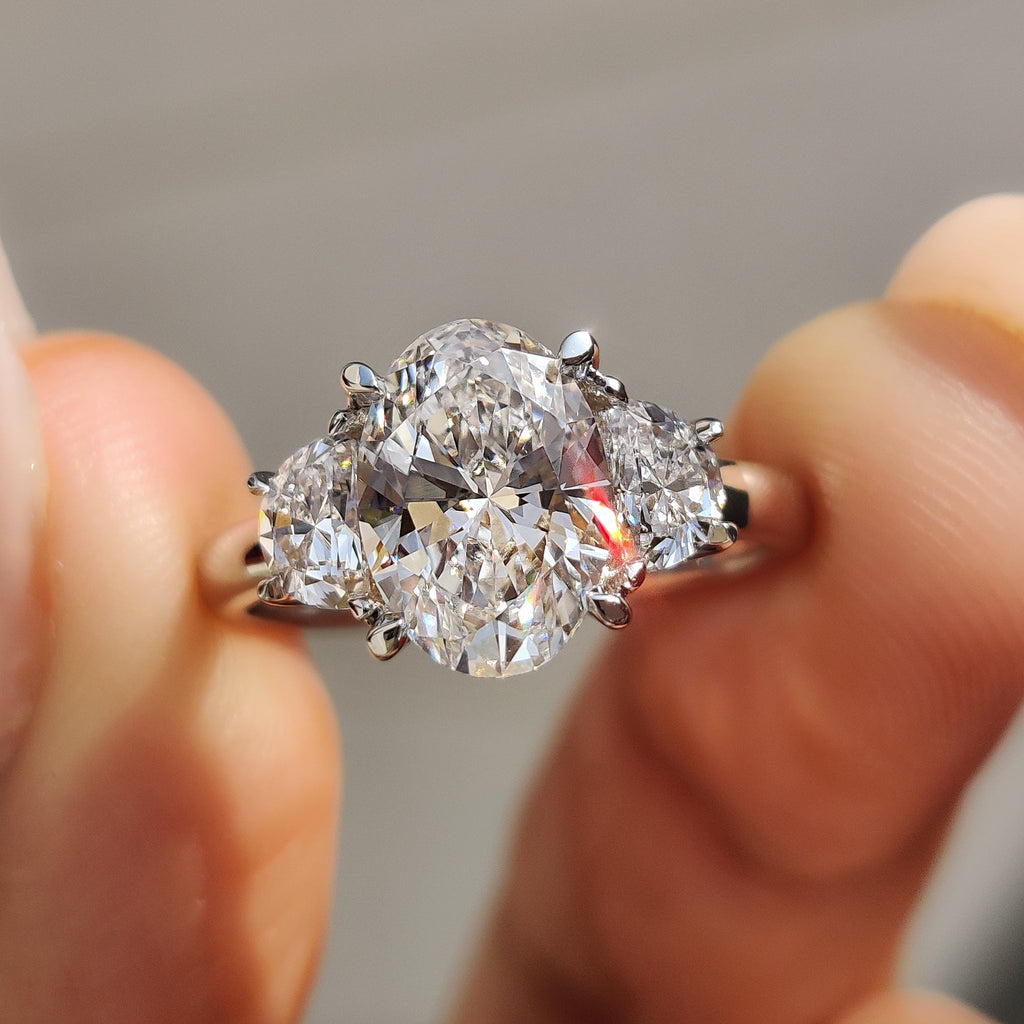Oval Cut Diamond Engagement Ring With Half Moon Side Stone