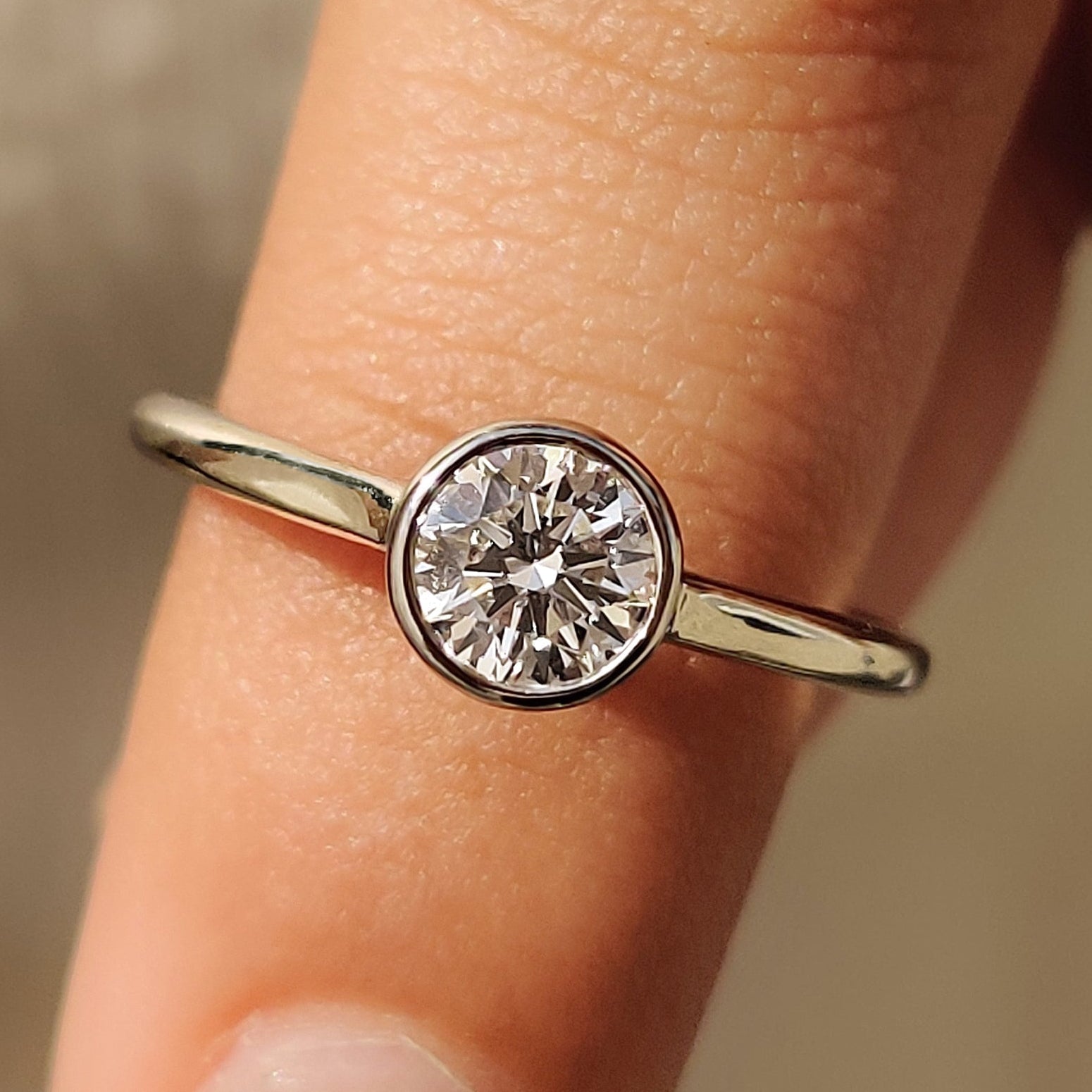 Round Cut Diamond Ring in Bezel Solitaire Setting Main image