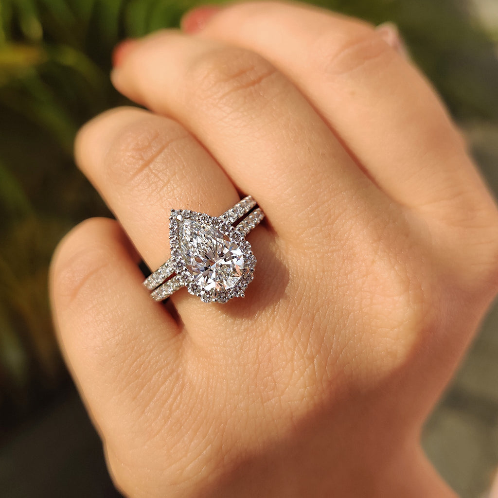 Pear Shaped Halo Engagement Ring In Round Cut Halo Style