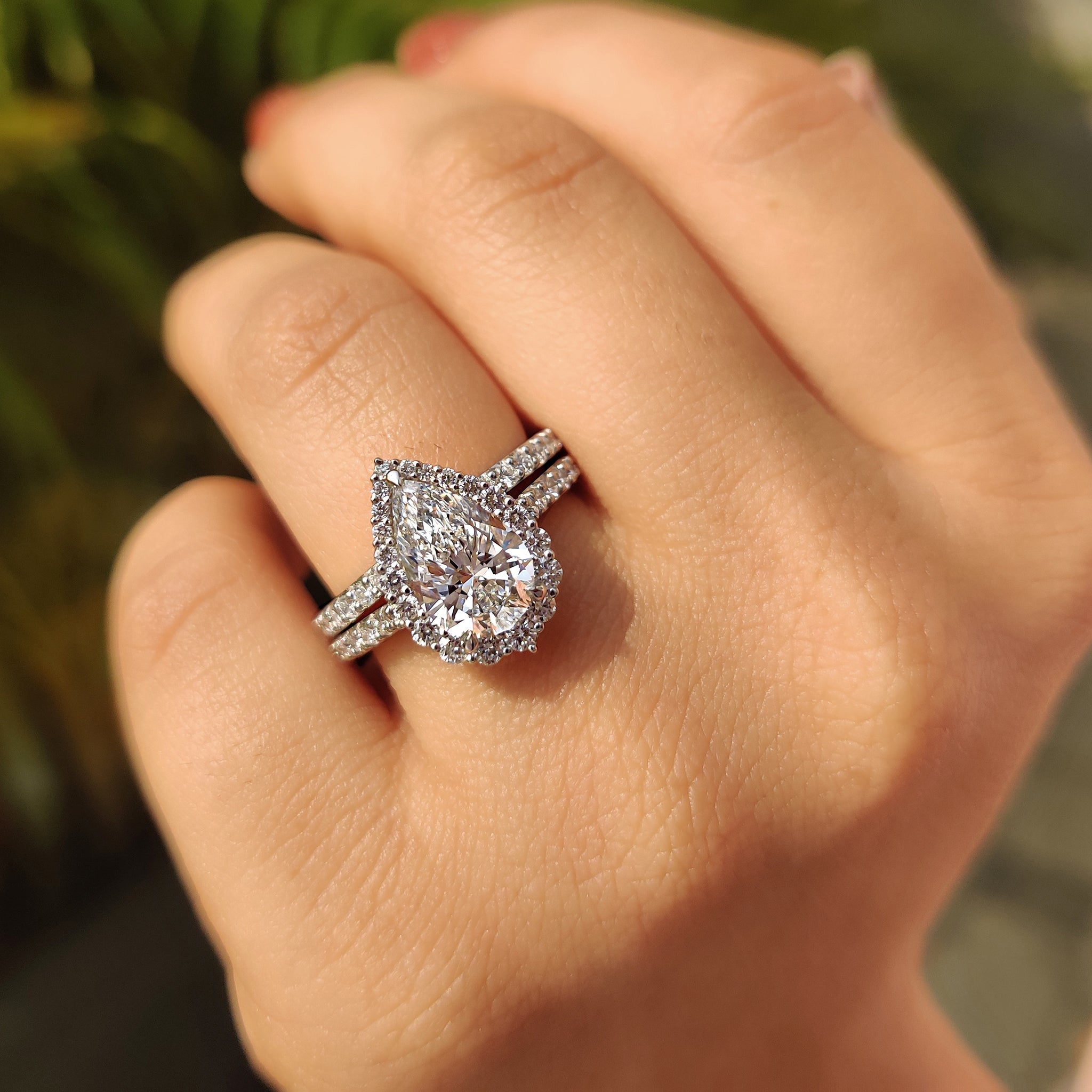 Pear Shaped Halo Engagement Ring In Round Cut Halo Style