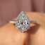 Pear Shaped Halo Engagement Ring In Round Cut Halo Style