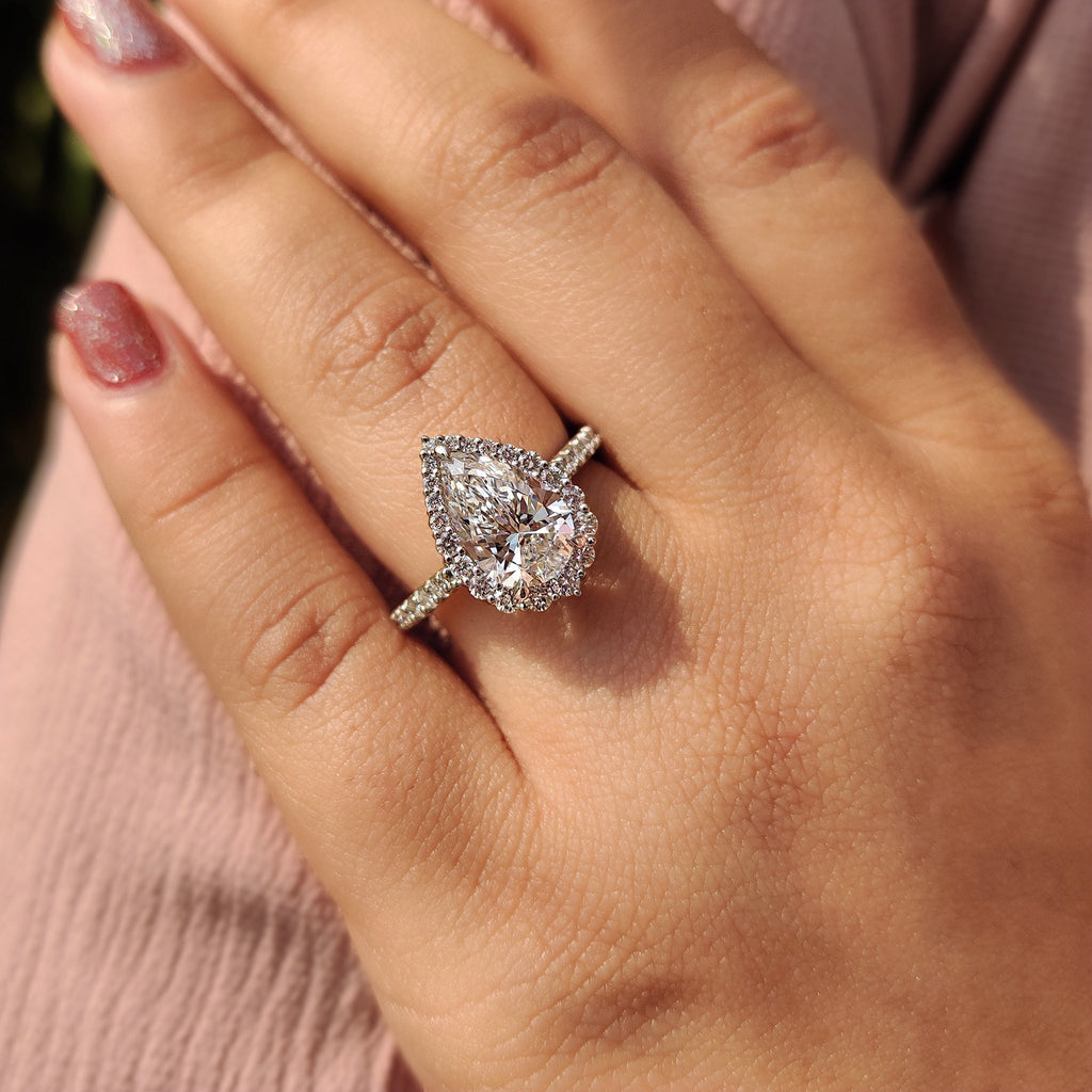 Pear Shaped Halo Engagement Ring In Round Cut Halo Style