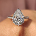 Pear Shaped Halo Engagement Ring In Round Cut Halo Style