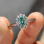 Oval Halo Engagement Ring In Cathedral Setting