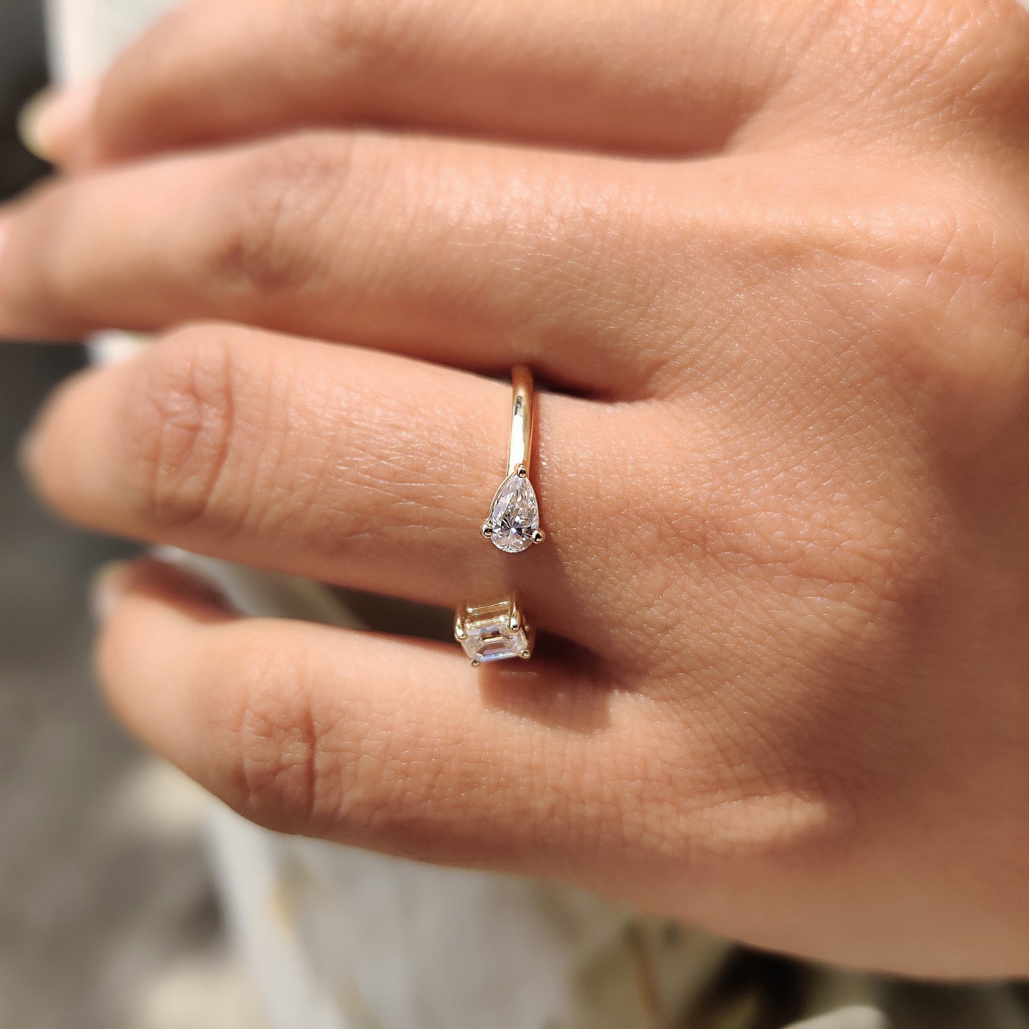 2 Stone Engagement Ring Featuring Emerald and Pear Cut
