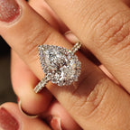 Pear Shaped Halo Engagement Ring In Round Cut Halo Style
