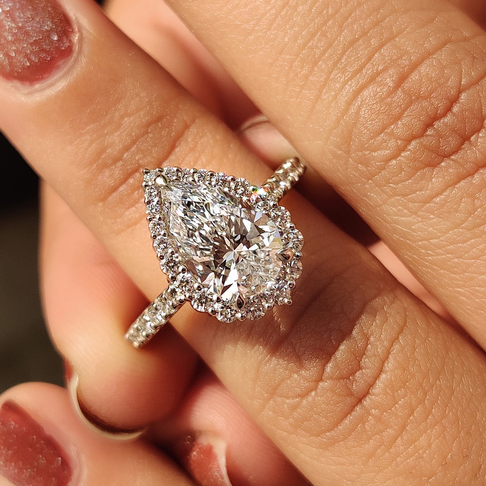 Pear Shaped Halo Engagement Ring In Round Cut Halo Style