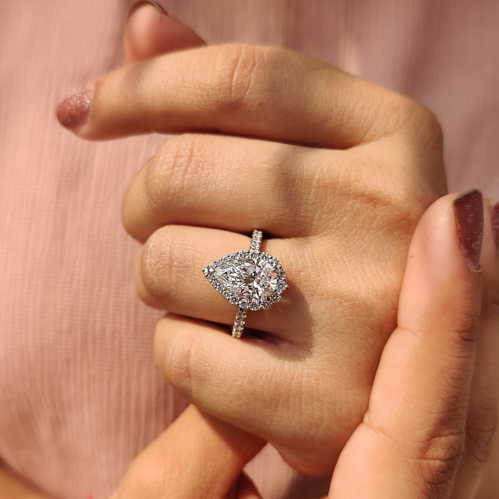 Pear Shaped Halo Engagement Ring In Round Cut Halo Style