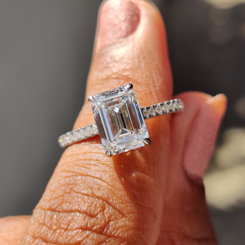 White Gold Emerald Cut Engagement Ring In Hidden Halo Design