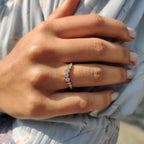 Curvy Wedding Band With Round Cut Moissanite