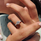side stone engagement ring with round and marquise cut