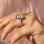 Pear Shaped Halo Engagement Ring In Round Cut Halo Style