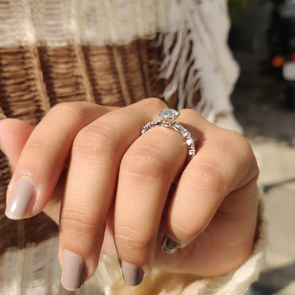 Oval Cut Engagement Ring With Round And Marquise Side Stones