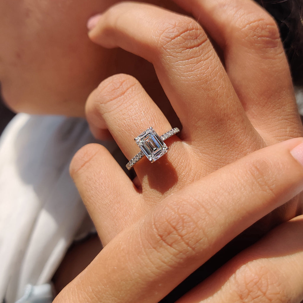 White Gold Emerald Cut Engagement Ring In Hidden Halo Design