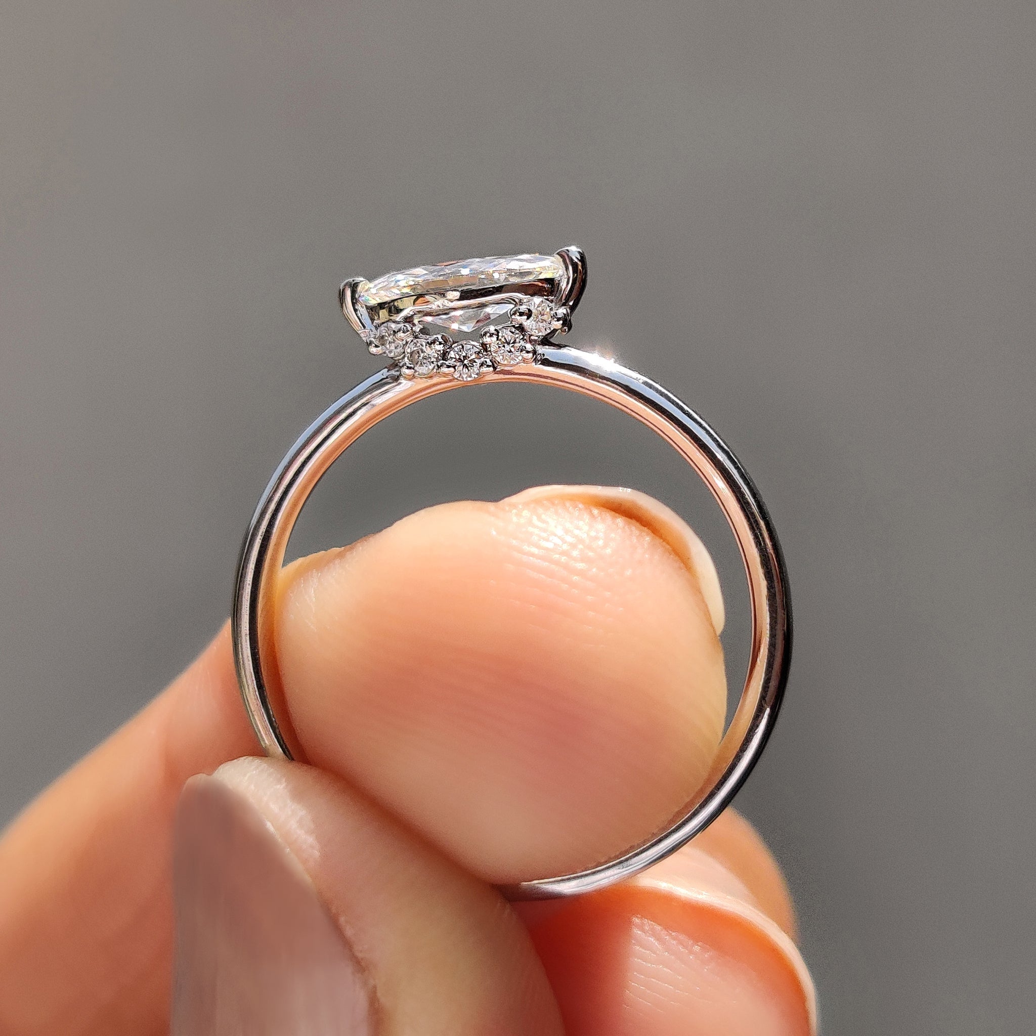 Round Side Stone With East West Marquise Ring