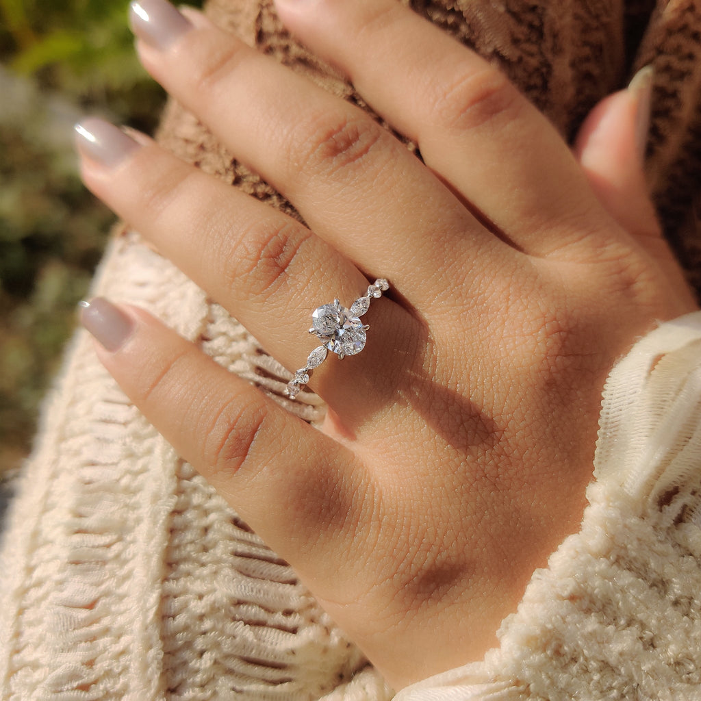 Oval Cut Engagement Ring With Round And Marquise Side Stones