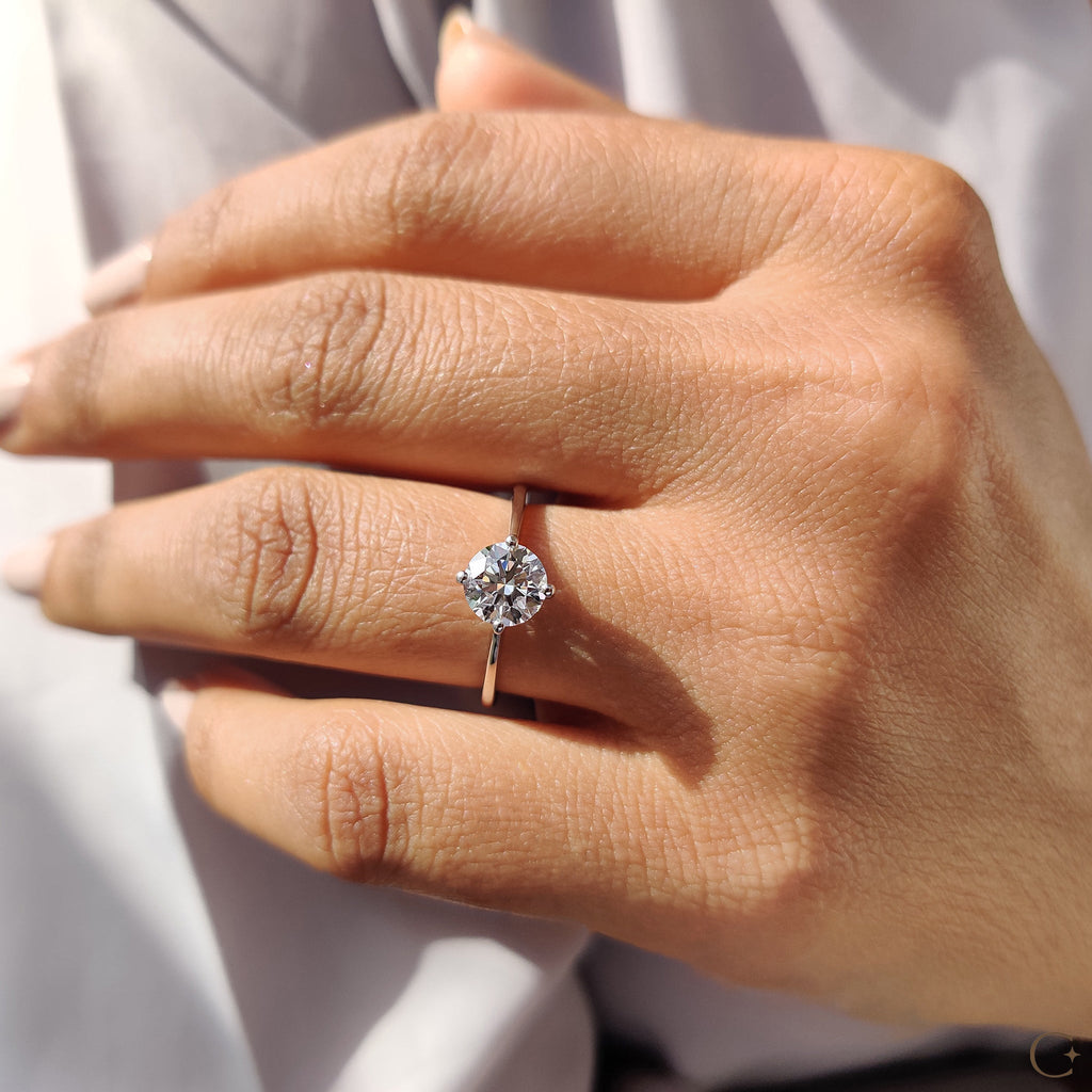 Round Solitaire Engagement Ring With Tapered Shank Design