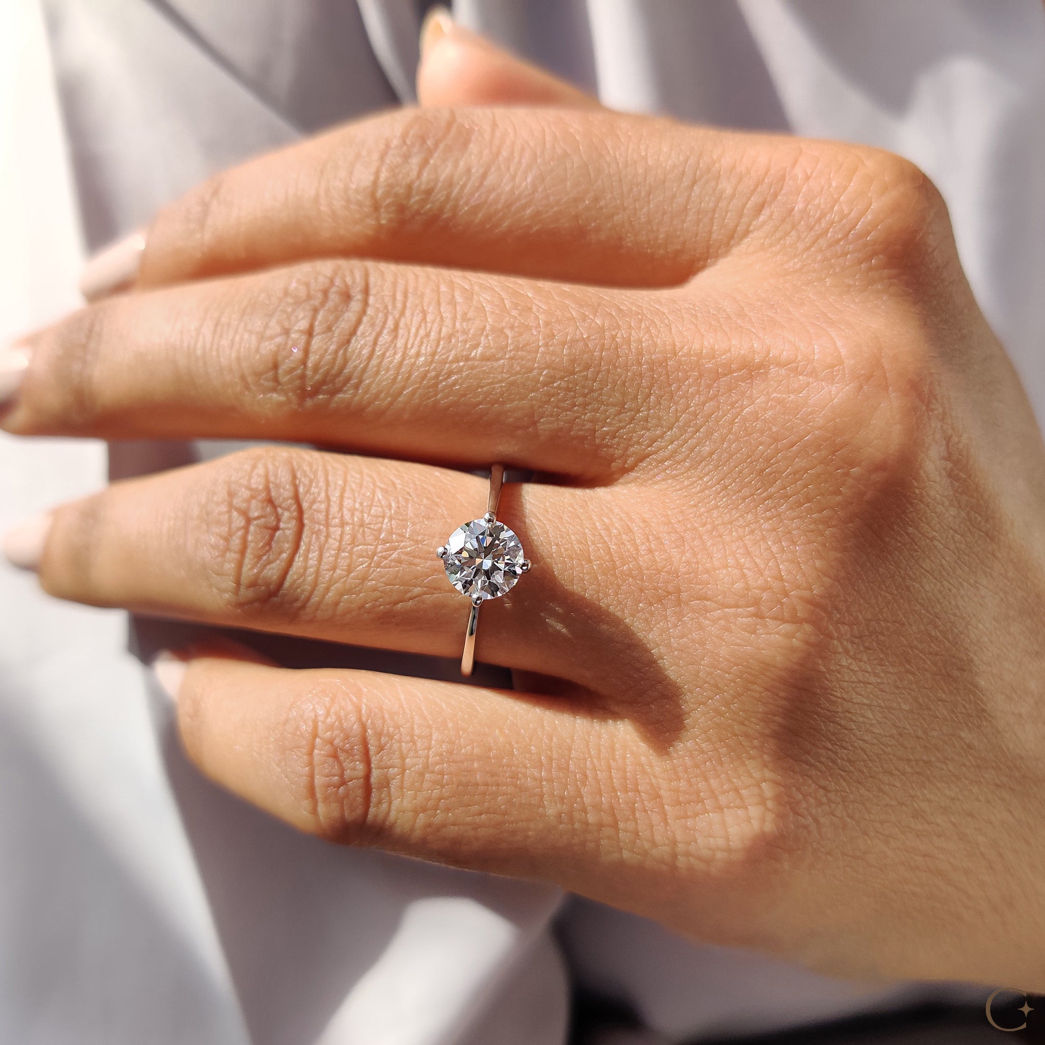 Round Solitaire Engagement Ring With Tapered Shank Design
