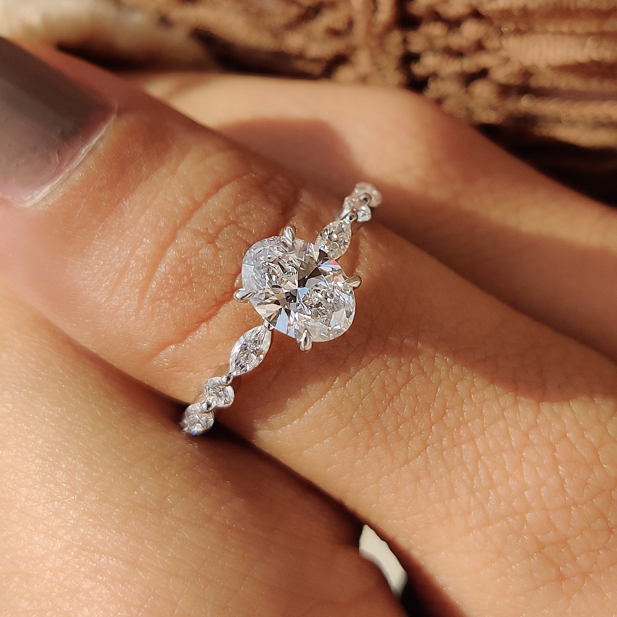 Oval Cut Engagement Ring With Round And Marquise Side Stones