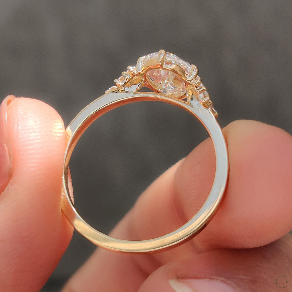 Oval Diamond Ring With Round Cut Side Stone