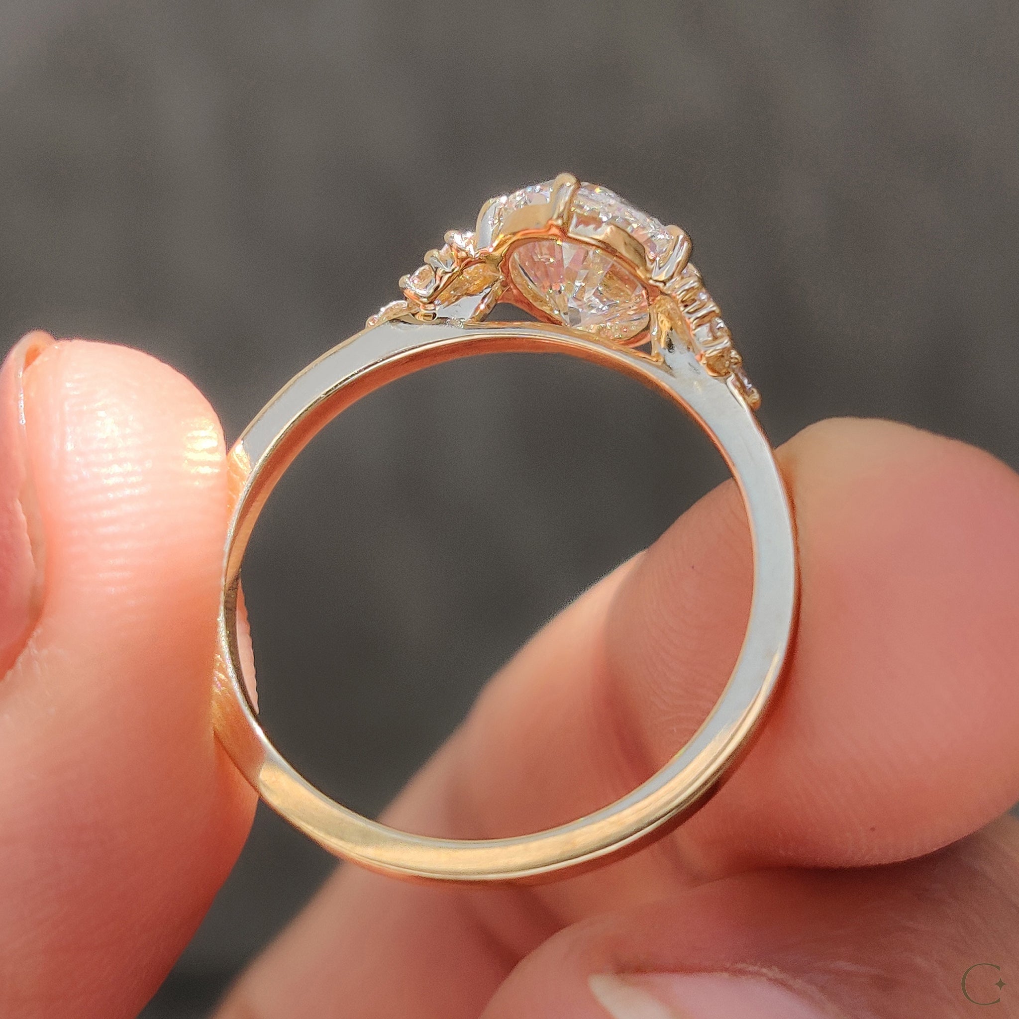 Oval Diamond Ring With Round Cut Side Stone