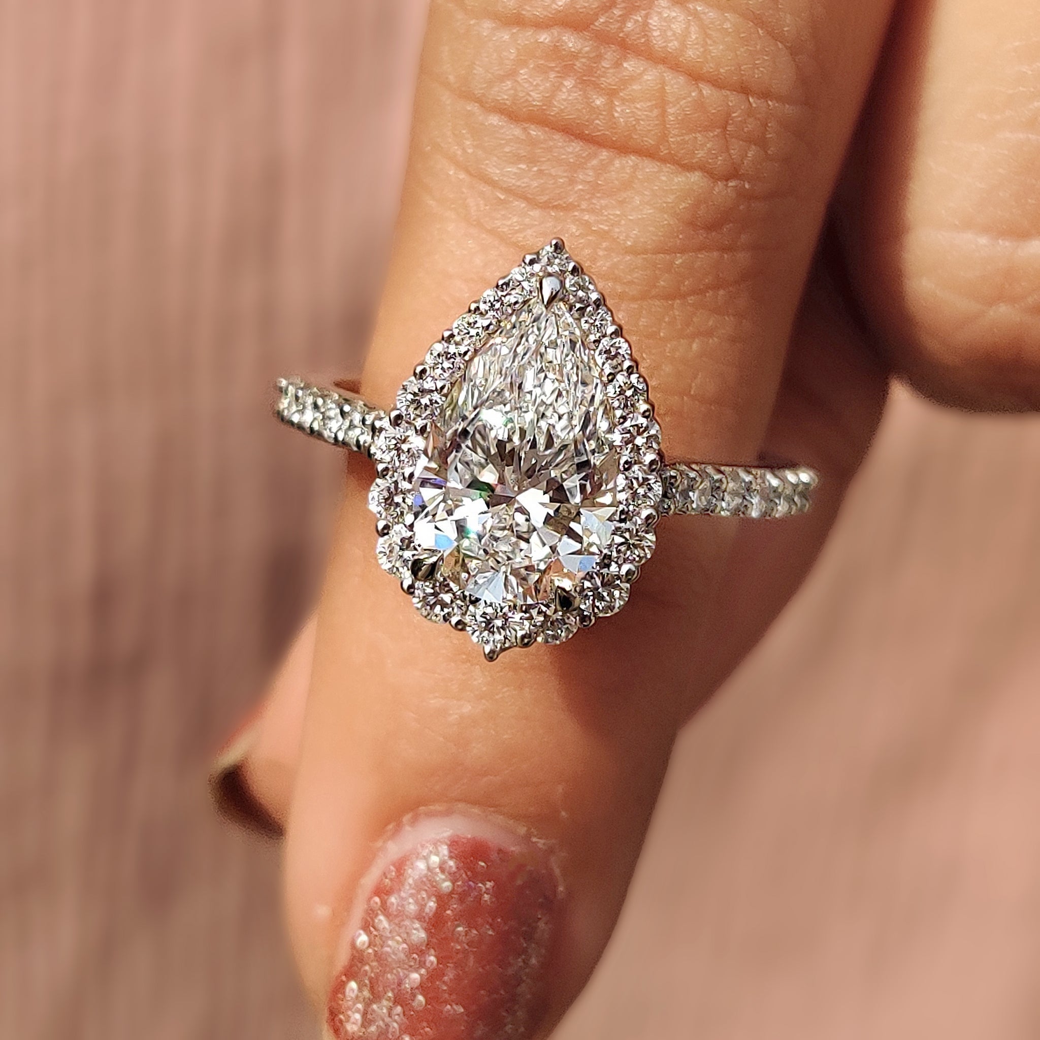 Pear Shaped Halo Engagement Ring In Round Cut Halo Style