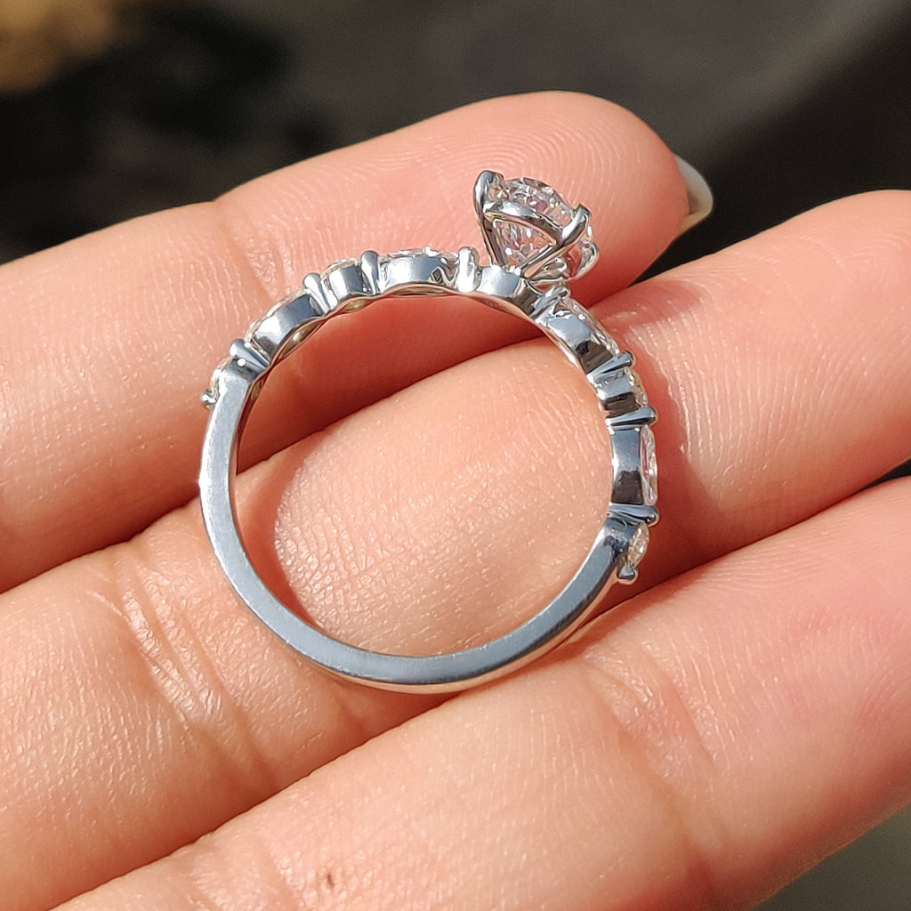 Oval Cut Engagement Ring With Round And Marquise Side Stones