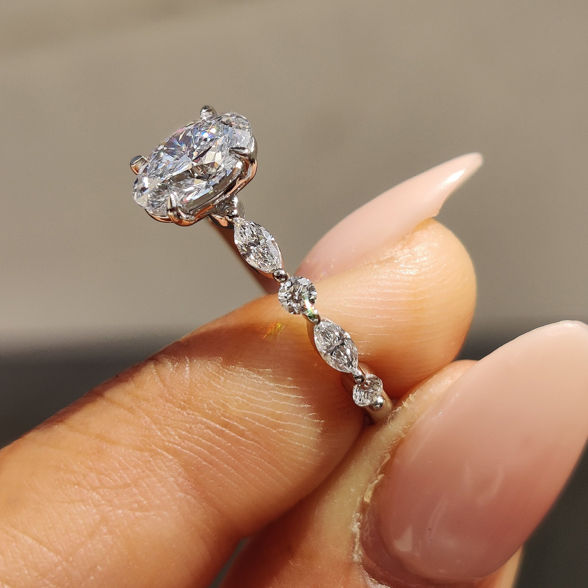 Oval Cut Engagement Ring With Round And Marquise Side Stones