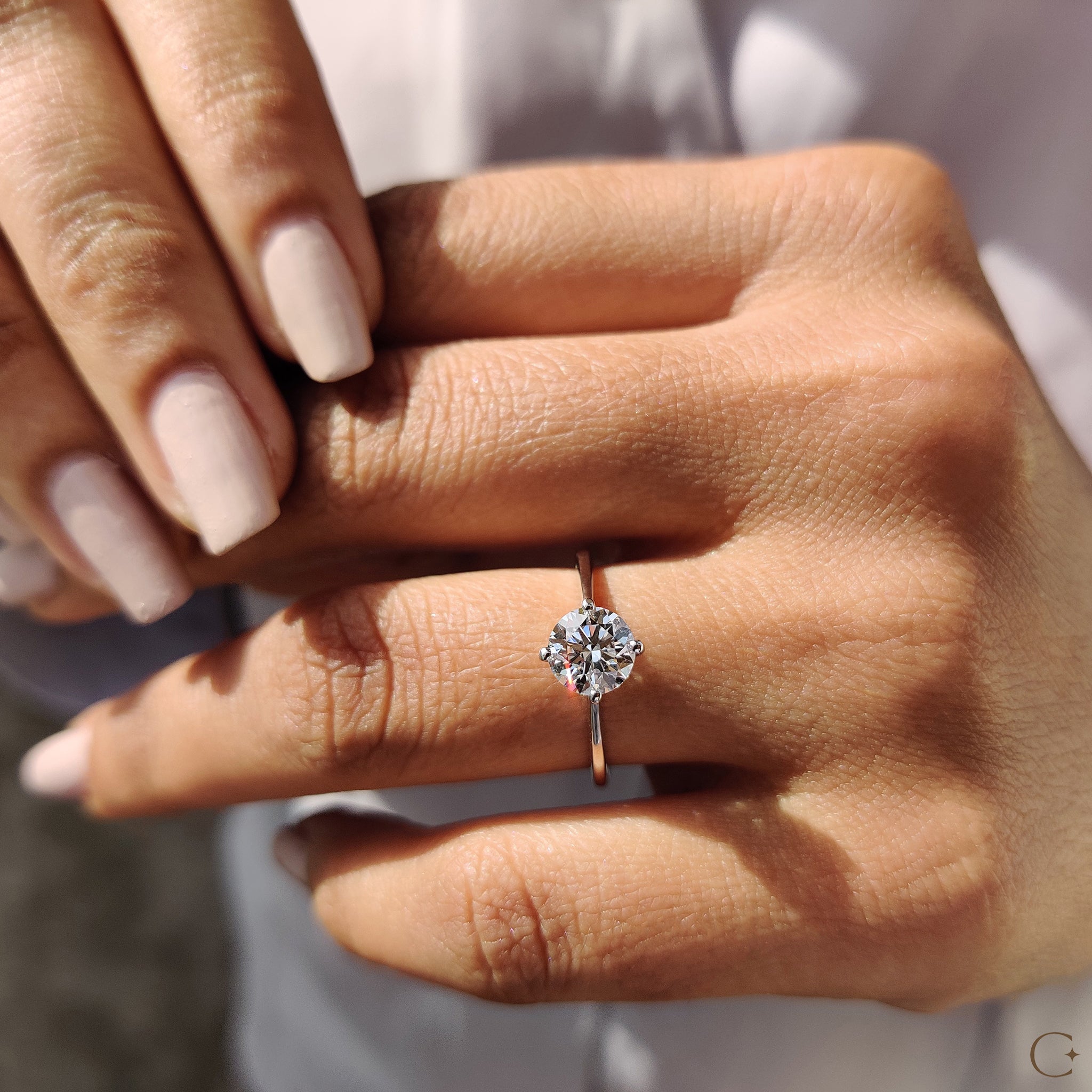 Round Solitaire Engagement Ring With Tapered Shank Design