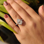 Pear Shaped Halo Engagement Ring In Round Cut Halo Style