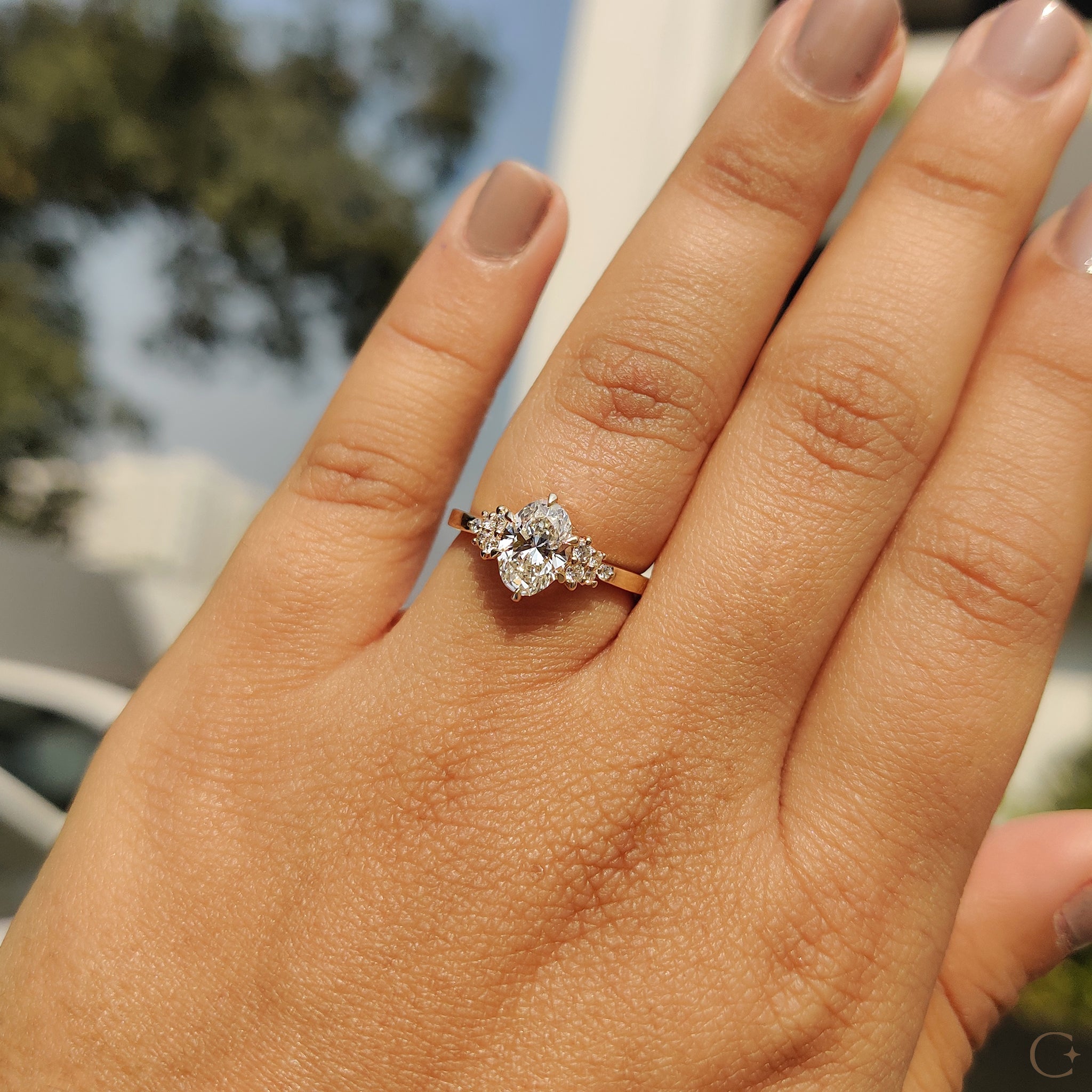 Oval Cut Engagement Ring In Cluster Setting