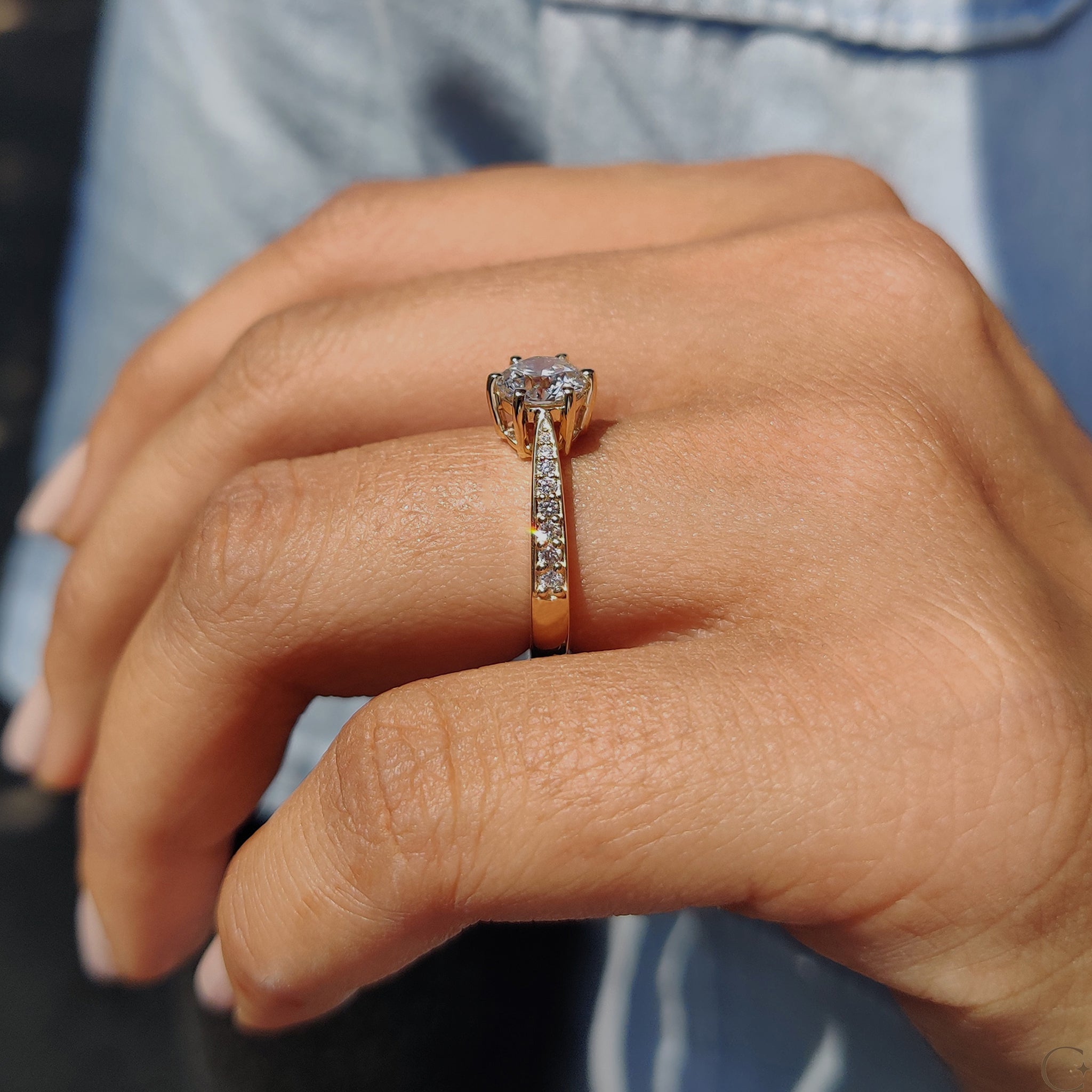 Round Cut Engagement Ring with Tapered Pave Setting