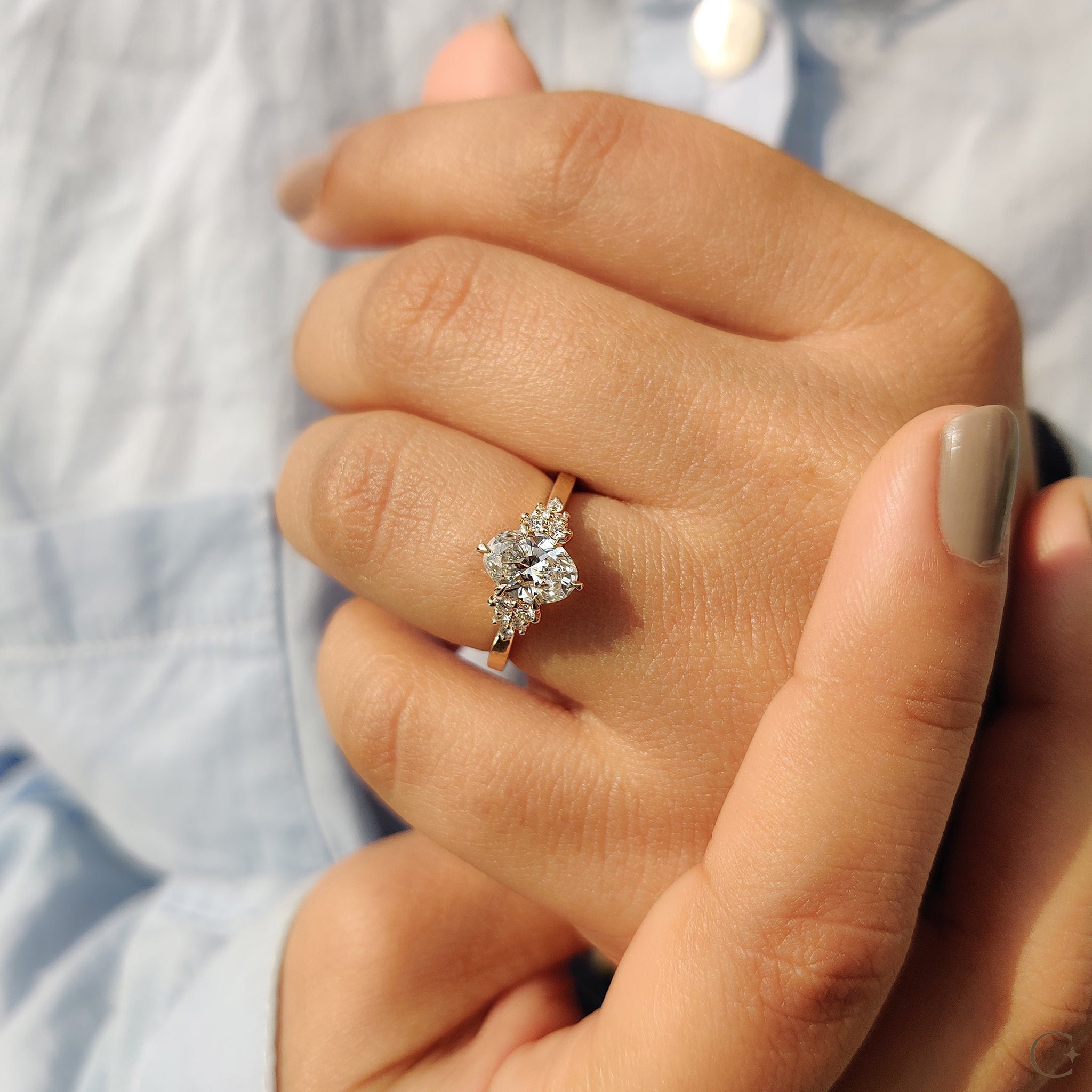 Oval Cut Engagement Ring In Cluster Setting