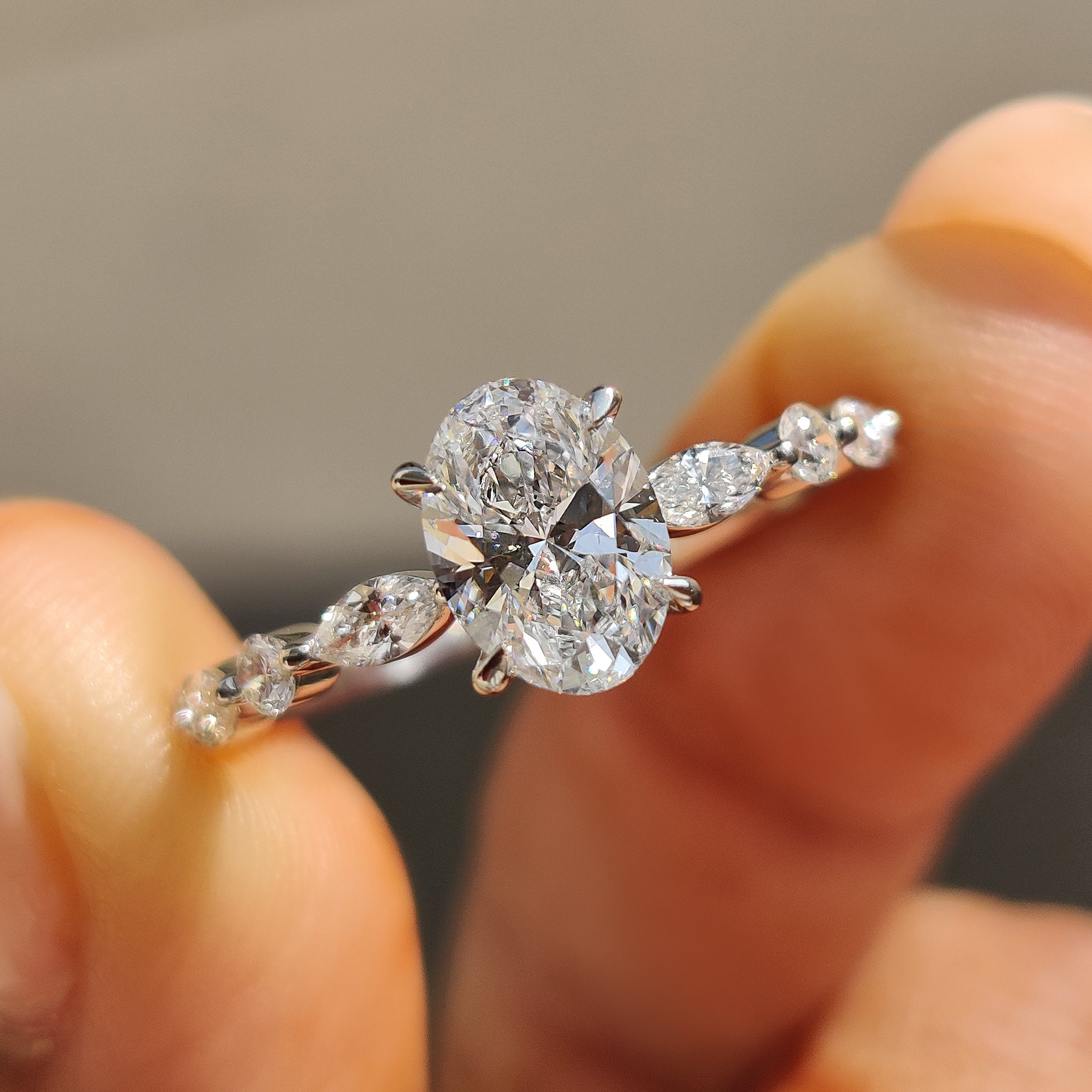 Oval Cut Engagement Ring With Round And Marquise Side Stones