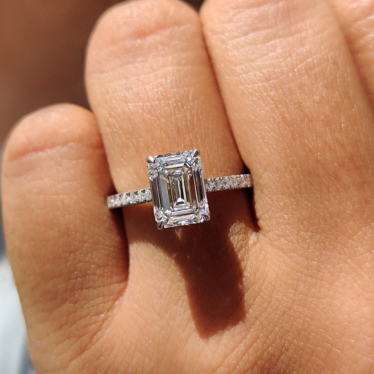 White Gold Emerald Cut Engagement Ring In Hidden Halo Design