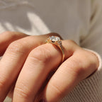 Oval Diamond Ring With Round Cut Side Stone