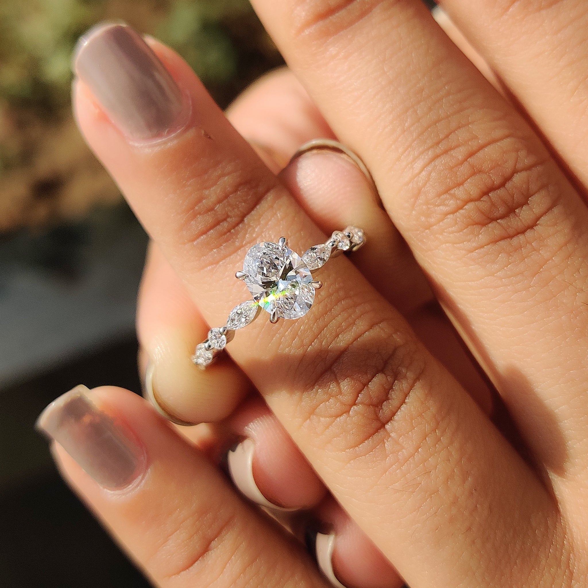 Oval Cut Engagement Ring With Round And Marquise Side Stones Secondary image