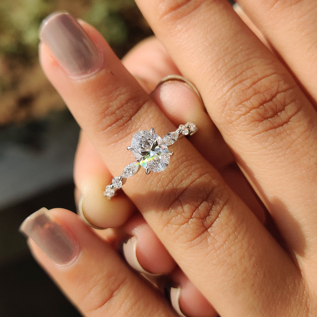 Oval Cut Engagement Ring With Round And Marquise Side Stones