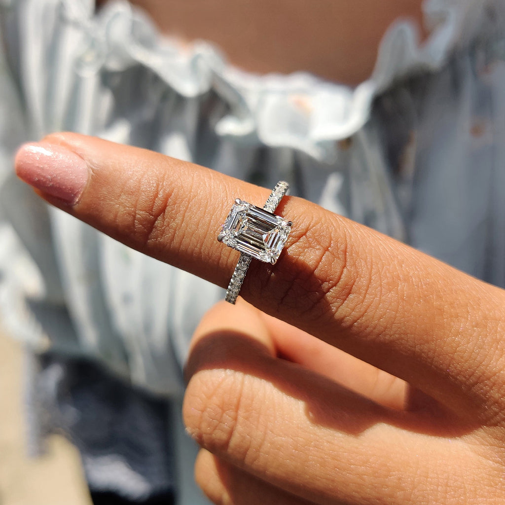 White Gold Emerald Cut Engagement Ring In Hidden Halo Design