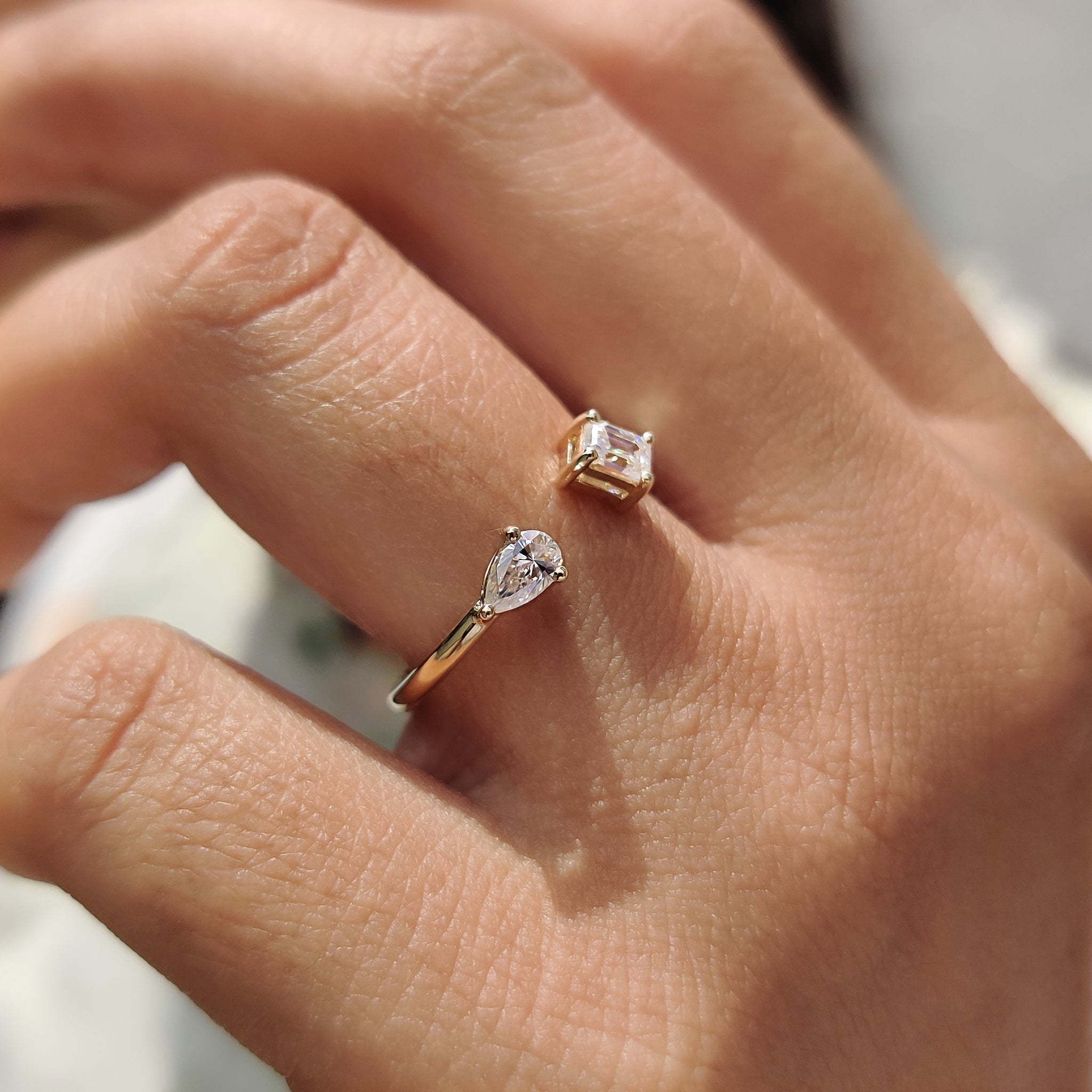 2 Stone Engagement Ring Featuring Emerald and Pear Cut