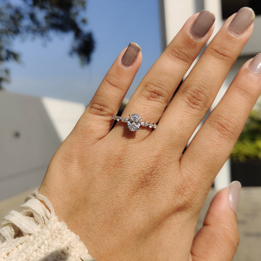 Oval Cut Engagement Ring With Round And Marquise Side Stones