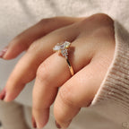 Oval Diamond Ring With Round Cut Side Stone