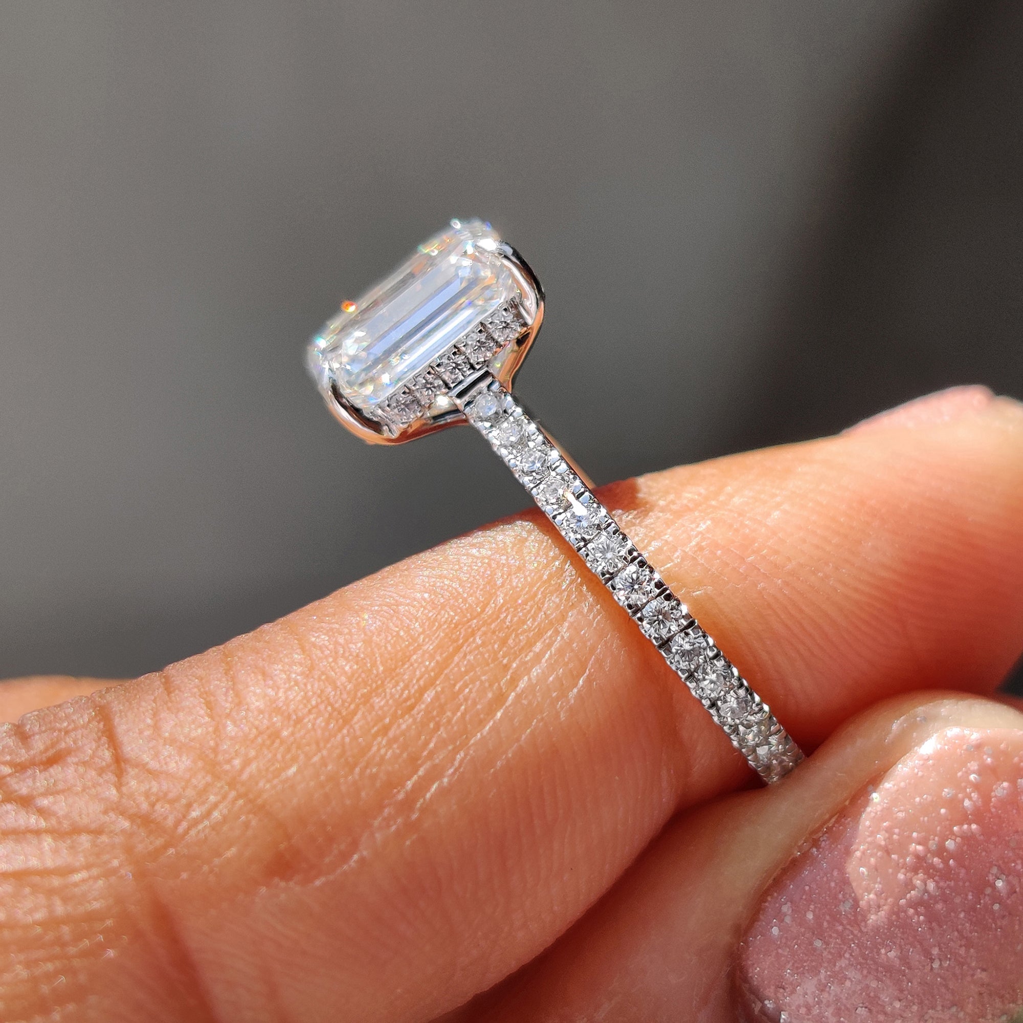 White Gold Emerald Cut Engagement Ring In Hidden Halo Design