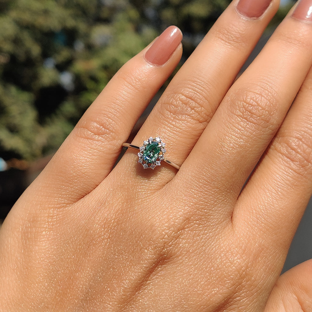 Oval Halo Engagement Ring In Cathedral Setting