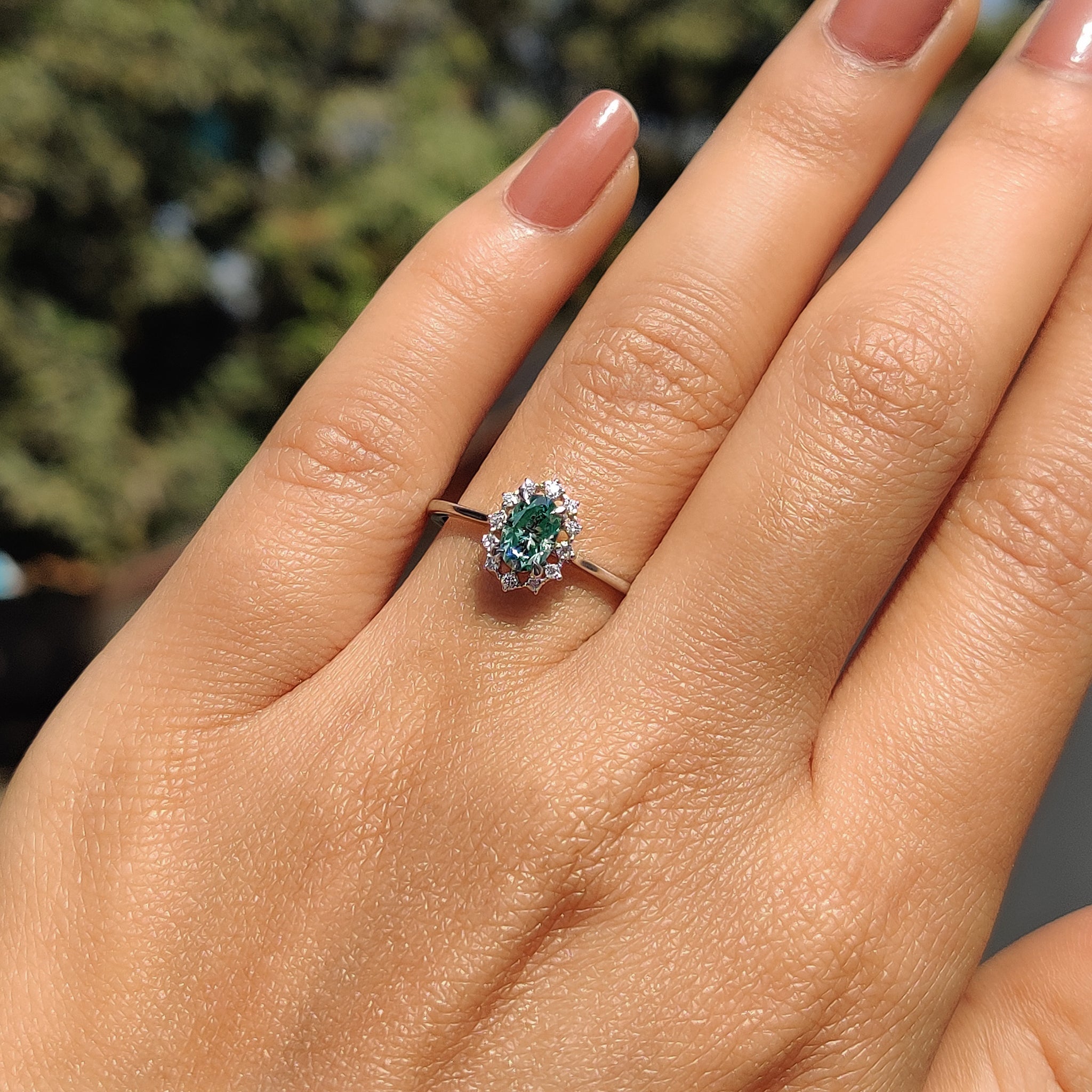 Oval Halo Engagement Ring In Cathedral Setting
