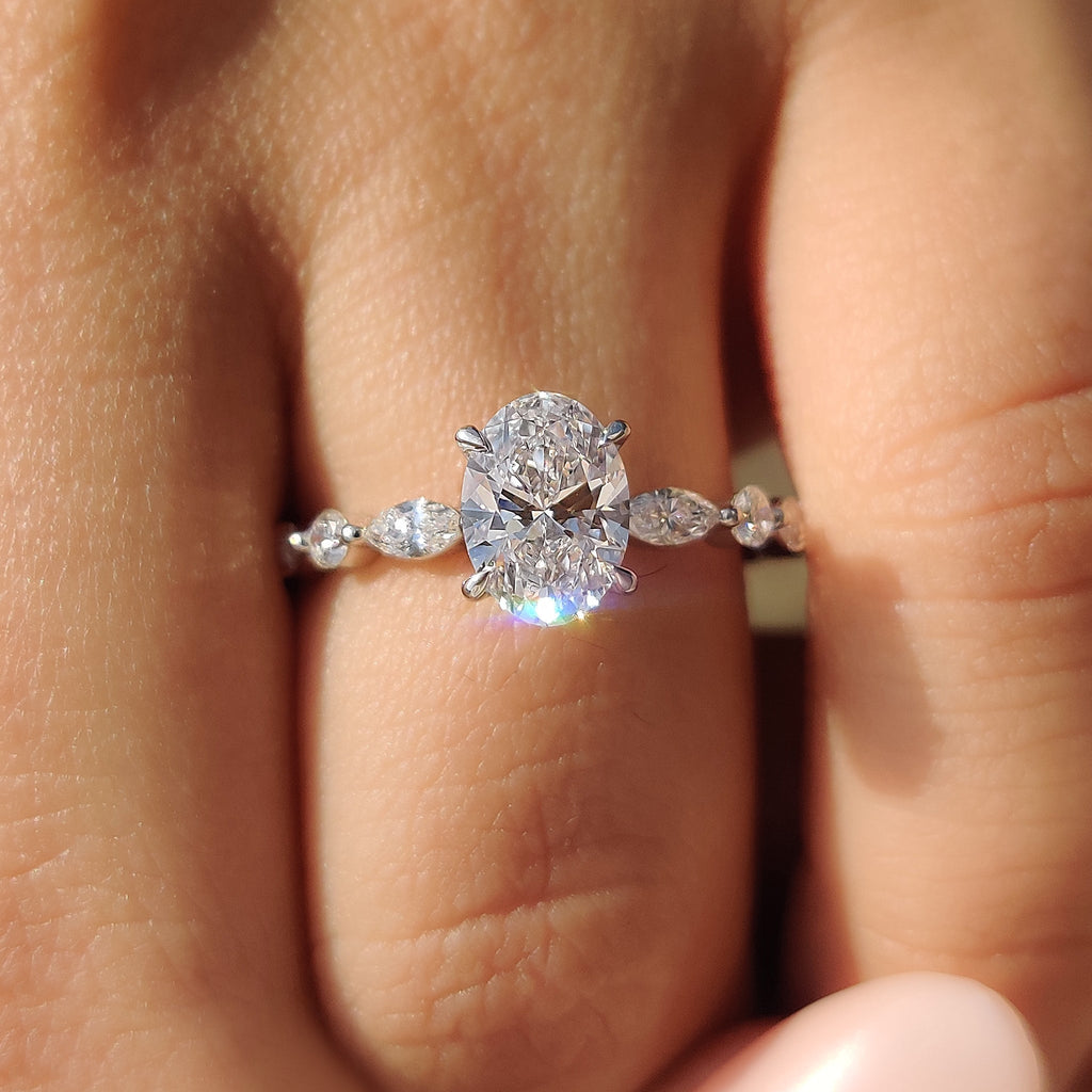 Oval Cut Engagement Ring With Round And Marquise Side Stones