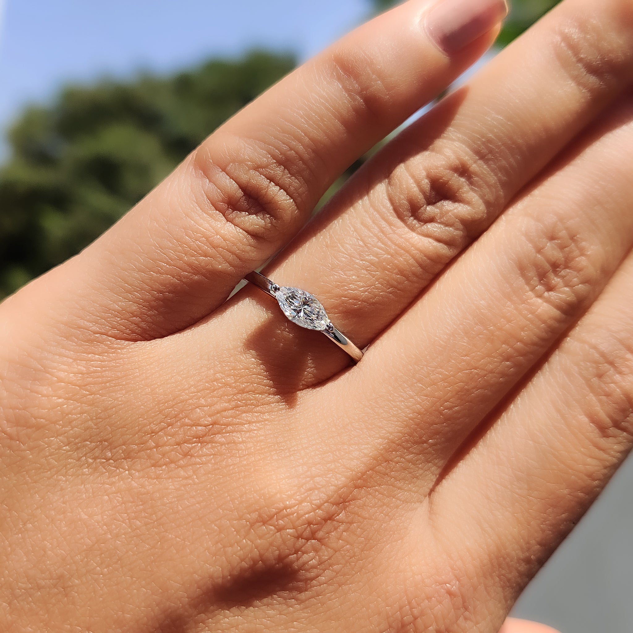 Round Side Stone With East West Marquise Ring