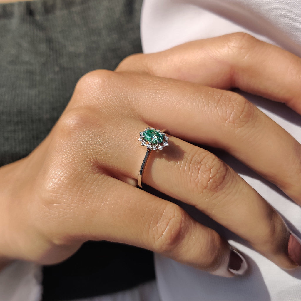 Oval Halo Engagement Ring In Cathedral Setting